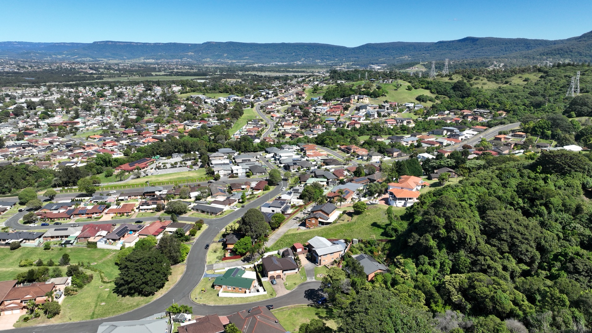 Property with escarpment and mountain backdrop