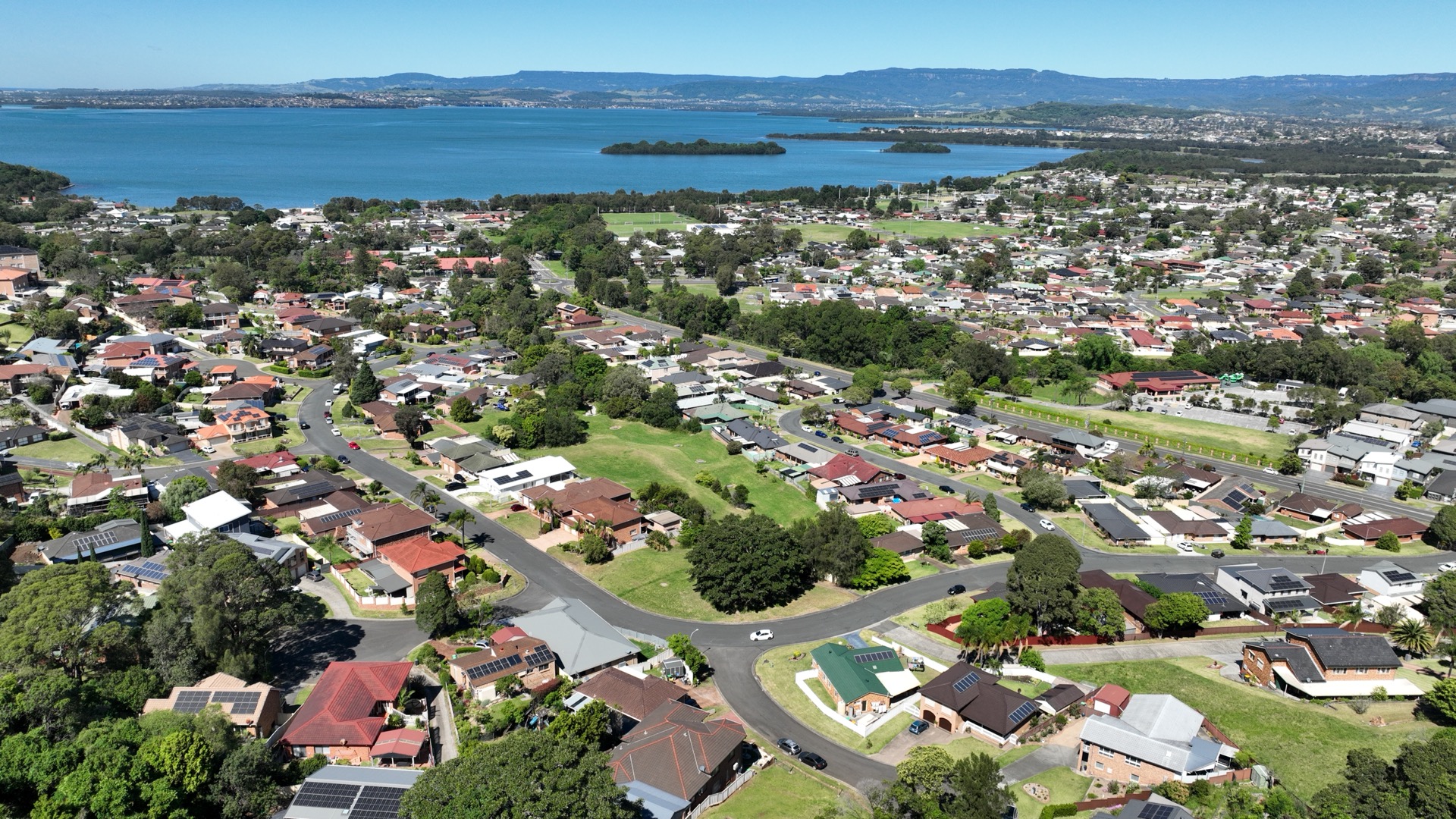 Aerial view showing Berkeley's proximity to Lake Illawarra and Wollongong